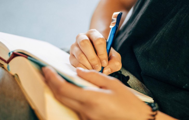 Writing in book